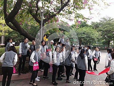 Shenzhen, China: young women employees are doing activities outdoors Editorial Stock Photo