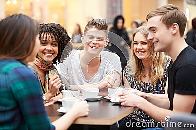 Group Of Young Friends Meeting In Cafe Stock Photo