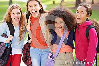 Group Of Young Girls Hanging Out In Park Together Stock Photo