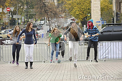 Group of young girls, street dancers, dancing on the pavement Editorial Stock Photo