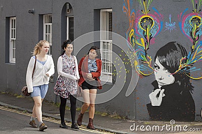 Group of young girls walking along Brighton street Editorial Stock Photo