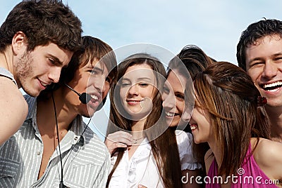 Group of young guys and girls in park Stock Photo
