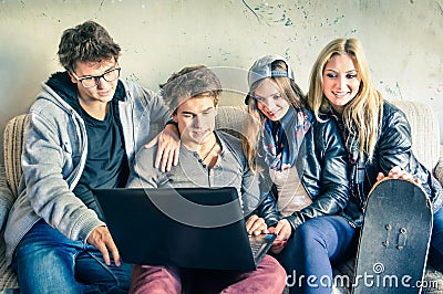 Group of young hipster best friends with computer Stock Photo