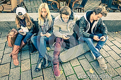 Group of young hipster friends playing with smartphone Stock Photo