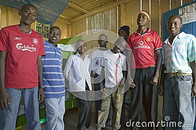 A group of young Kenyan males, who are affected with HIV/AIDS, pose for camera at Pepo La Tumaini Jangwani, HIV/AIDS Community Editorial Stock Photo