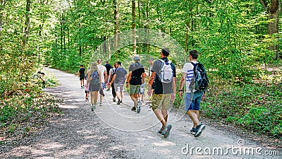 Group of young men and women hiking in the Moselle River Valley near Burg Eltz Castle in Germany Editorial Stock Photo