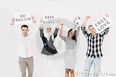 Group of young multiracial people posing together for protesting demonstration, holding posters with antiwar, justice Stock Photo