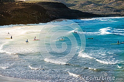 Group of young people at beach going surfing Editorial Stock Photo