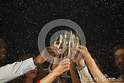 Group of young people celebrating new year with champagne at night club Stock Photo