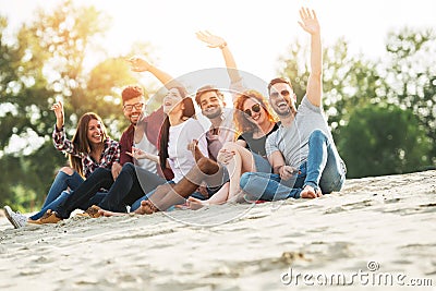 Group of young people having fun outdoors on the beach Stock Photo