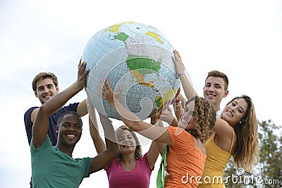 Group of young people holding a globe earth Stock Photo