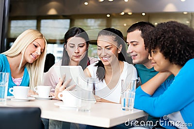 Group of young people in modern cafe Stock Photo