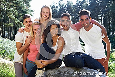 Group Of Young People Relaxing In Countryside Stock Photo