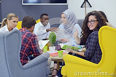 Group of young people, Startup entrepreneurs working on their venture in coworking space Stock Photo