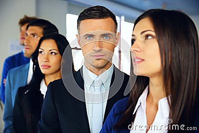 Group of a young serious businesspeople Stock Photo