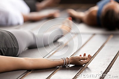 Group of young sporty people in Dead Body pose close up Stock Photo