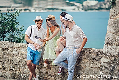 Group of young tourist friends with digital tablet Stock Photo