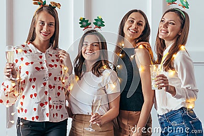 Group of young women celebrating Christmas, New year Stock Photo