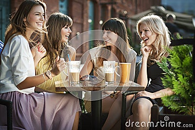 Group of young women drinking coffee Stock Photo