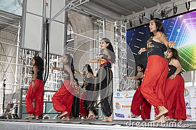 A group of young women performing a Bollywood Indian dance Editorial Stock Photo