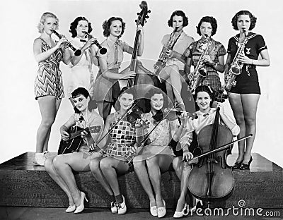 Group of young women playing instrument Stock Photo