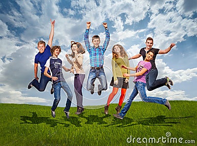 Groupe of jumping happy teenage friends Stock Photo