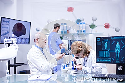 Groupe of researchers in pharmacology in a hospital laboratory Stock Photo