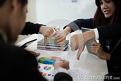 Groups of Asian businessmen show dislike or unlike thumbs down h Stock Photo