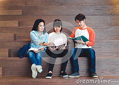 Groups of asian teenage students studying together at university Stock Photo