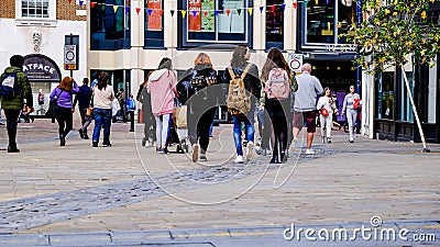 Groups Of People And Students Walking On High Street Editorial Stock Photo