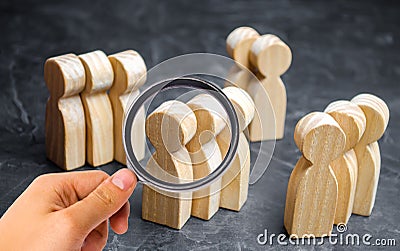 Groups of wooden people. The concept of market segmentation. Marketing segmentation, target audience, customer care. Market group Stock Photo