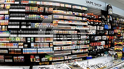 POV walking retail strip mall sidewalk smoke shop wall of carts Editorial Stock Photo