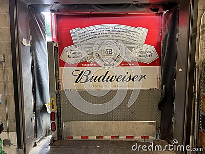 Retail store Budweiser delivery truck back to a grocery store dock bay Editorial Stock Photo