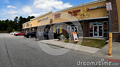 Retail strip mall beauty store and smoke shop Editorial Stock Photo