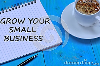 Grow your small business words on notebook Stock Photo