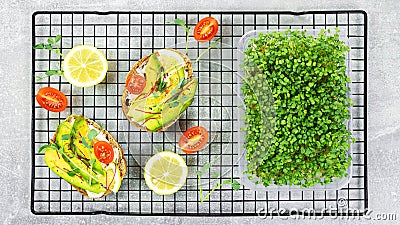 Growing microgreens at home. Recipes for sandwiches and snacks with microgreens of peas, arugula, broccoli. Quick meal variants Stock Photo