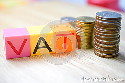 Growing taxes - colour blocks with VAT and money stacks Stock Photo