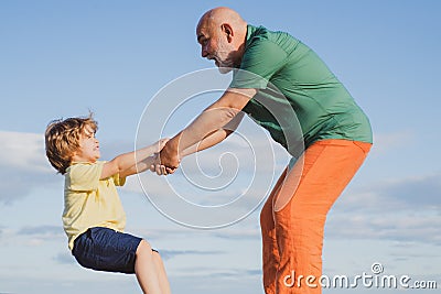 Grown up rebuking a little child for bad behavior. Father helping hand extended. We must educate our youngsters better. Stock Photo