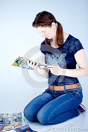 Adult woman reading comics books Editorial Stock Photo
