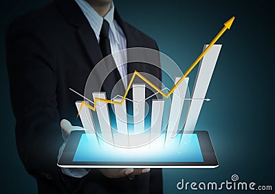 Growth chart on tablet technology Stock Photo