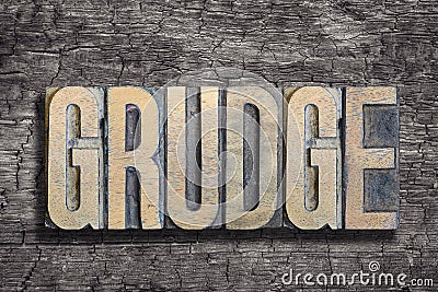 Grudge word burned wood Stock Photo