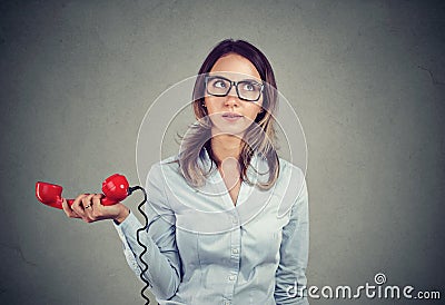 Grumpy displeased woman annoyed with unpleasant phone conversation Stock Photo