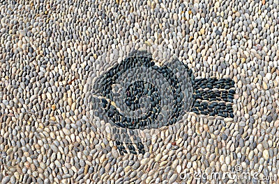 Grumpy fish pebbles mosaic on the floor on Rhodes island Stock Photo