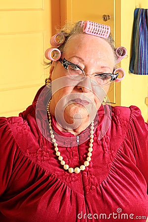 Grumpy Senior Granny with Curlers Stock Photo