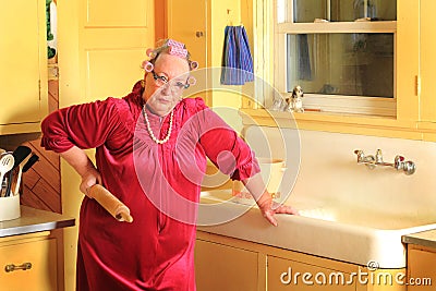 Grumpy Senior Granny with Rolling Pen Stock Photo