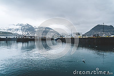 Grundarfjordur, Iceland - 03 January 2019: Harbor with motionless boats during the twilight of the afternoon, Kirkjufell Editorial Stock Photo