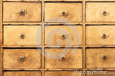 Old wooden drawer furniture ..Grunge box shaped storage with round brass handle in vintage shop Stock Photo