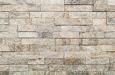 Grunge Brown stone wall tiles texture. Stock Photo