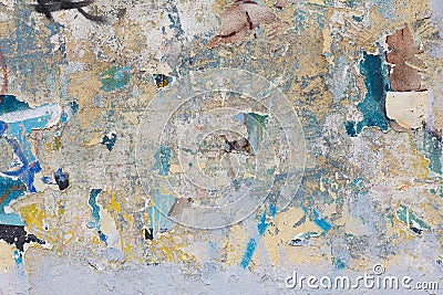 Grunge concrete wall with ripped posters Stock Photo