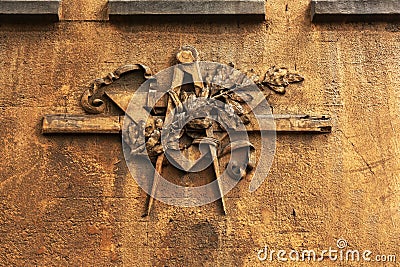 Grunge freemasonry emblem on a dramatic background - masonic triangle and compass, closeup of old architectural building Stock Photo